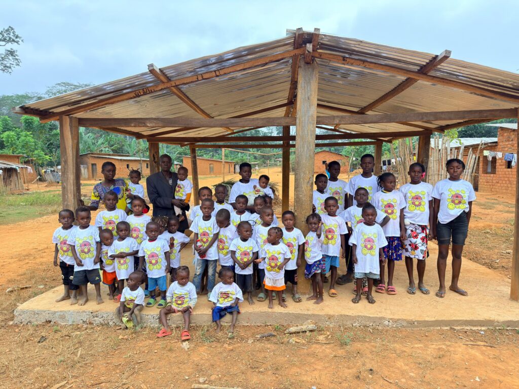 Group of children in matching t-shirts at a BOON-supported community project in a Congolese village